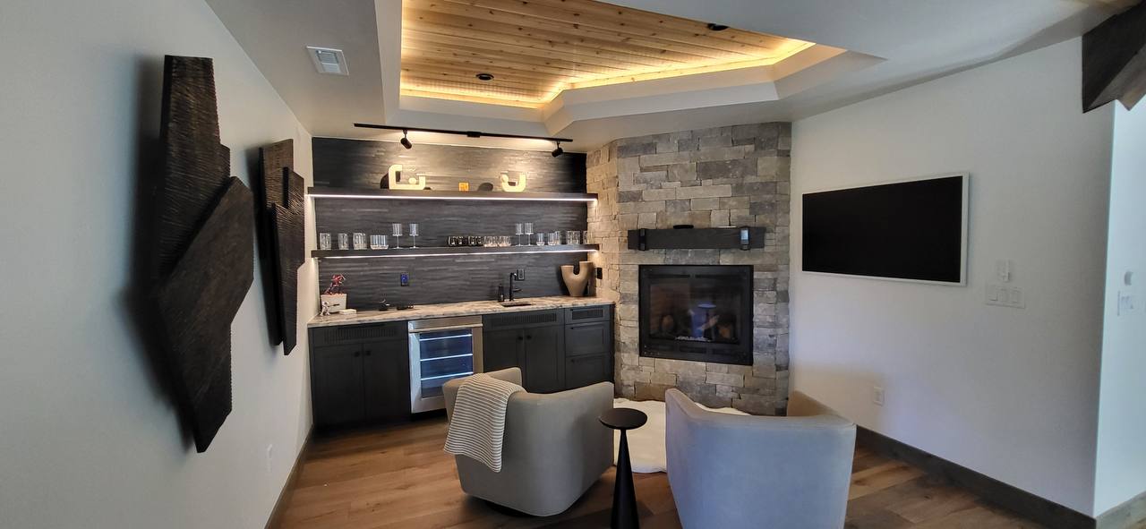 Custom stone fireplace and wet bar